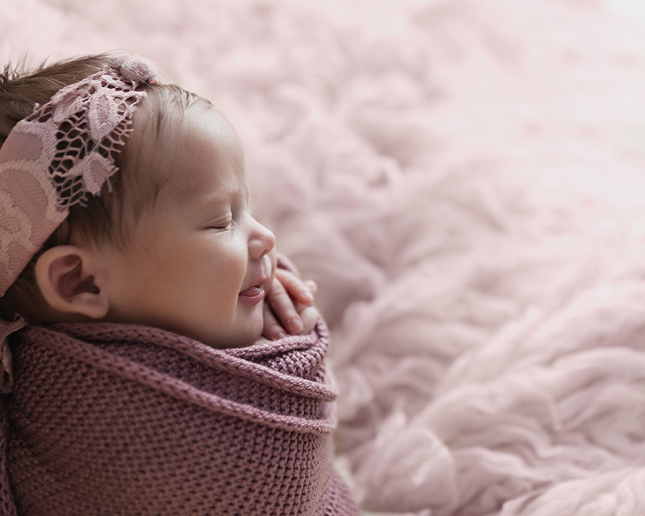 baby wrapping in pink