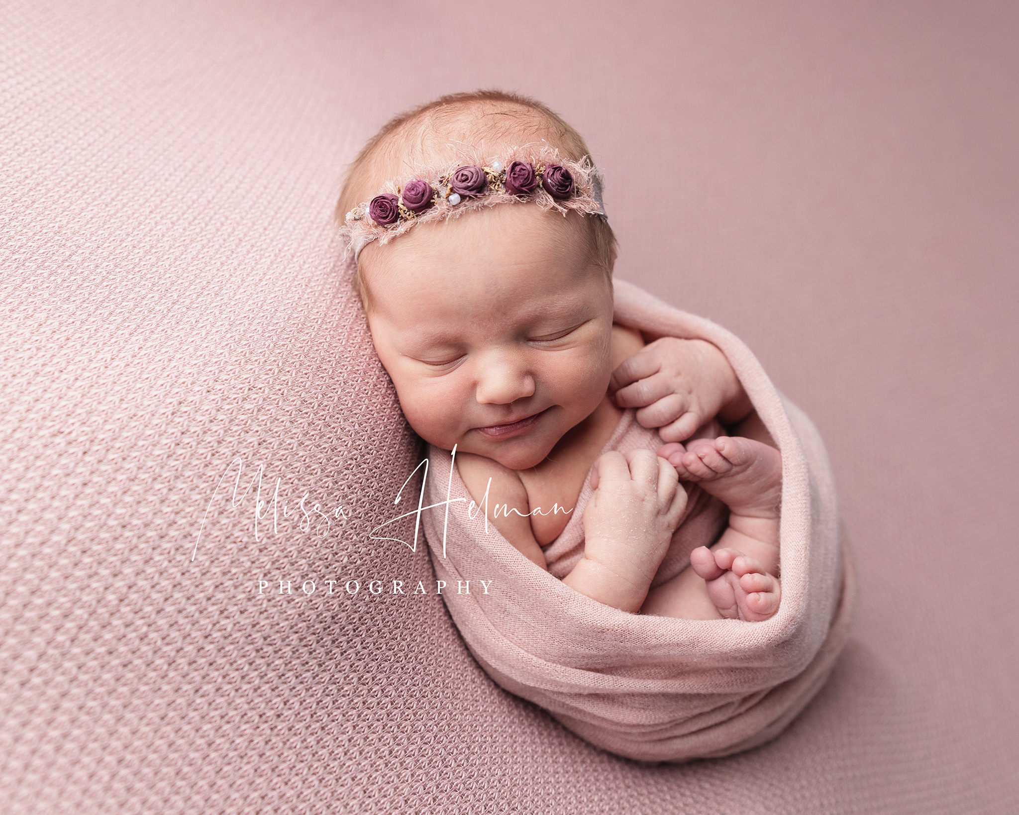 newborn swaddled in pin wrap for newborn portraits.