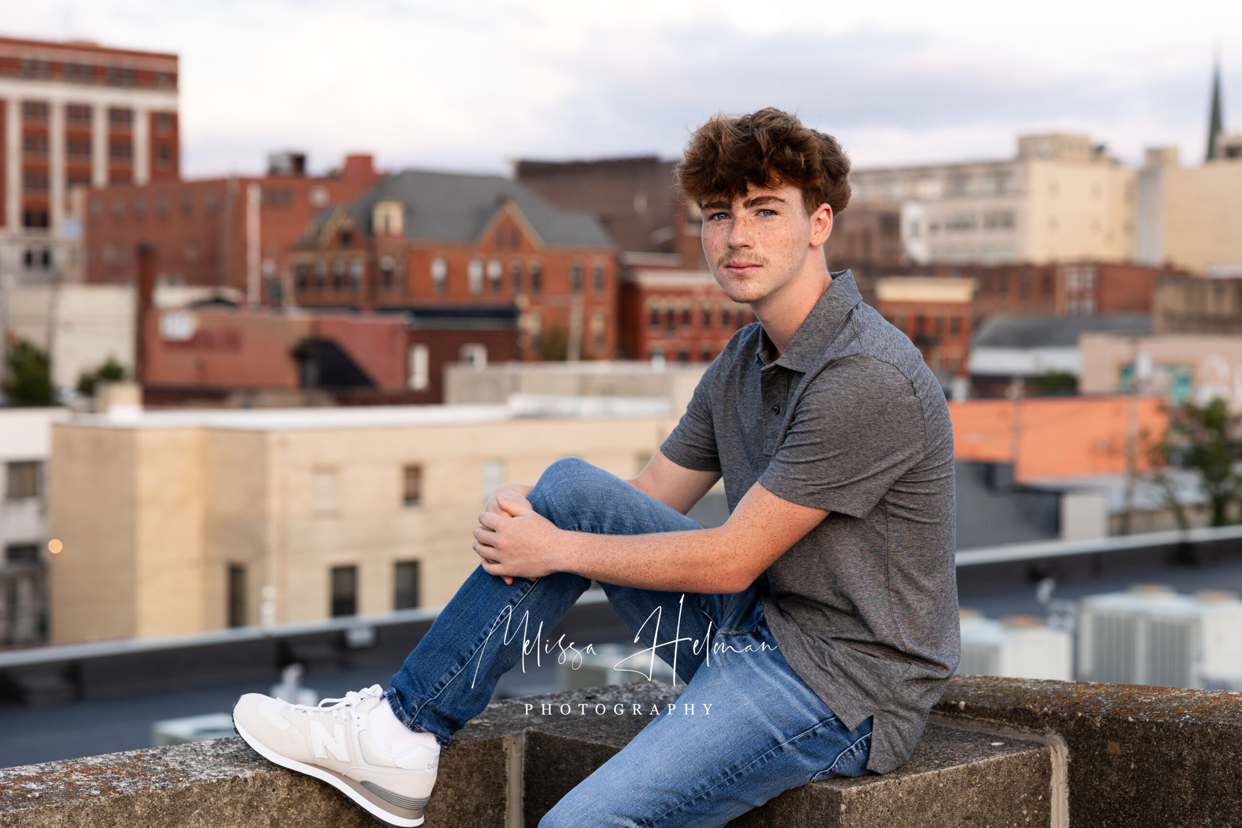 Golden hour senior portraits overlooking the Greensburg skyline captured by a Pittsburgh senior photographer