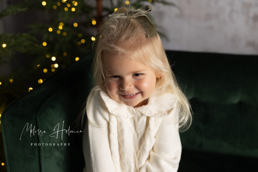 Little girl posing for her Holiday studio session in Pittsburgh portrait studio.